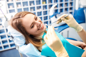 Overview of dental caries prevention.Woman at the dentist's chair during a dental procedure.